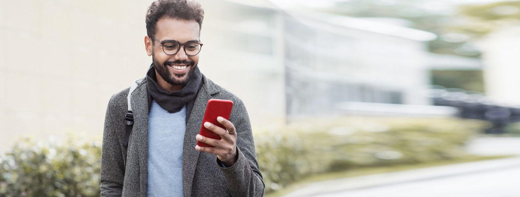 A Millennial reviews his account balance with the Patelco Mobile App.